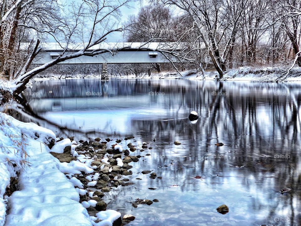 Beautiful winter day at the old covered bridge in Indiana on the white river. 