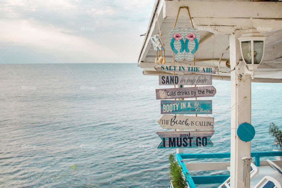 Summer in Bulgaria, Coastal beach signs with turquoise waters and nautical decor