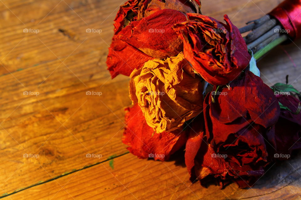 roses on wooden table