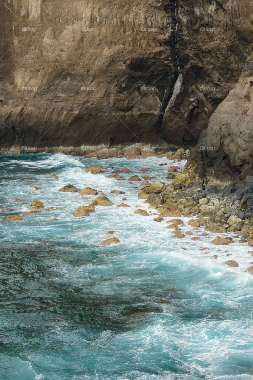 High angle view of cliffs in sea