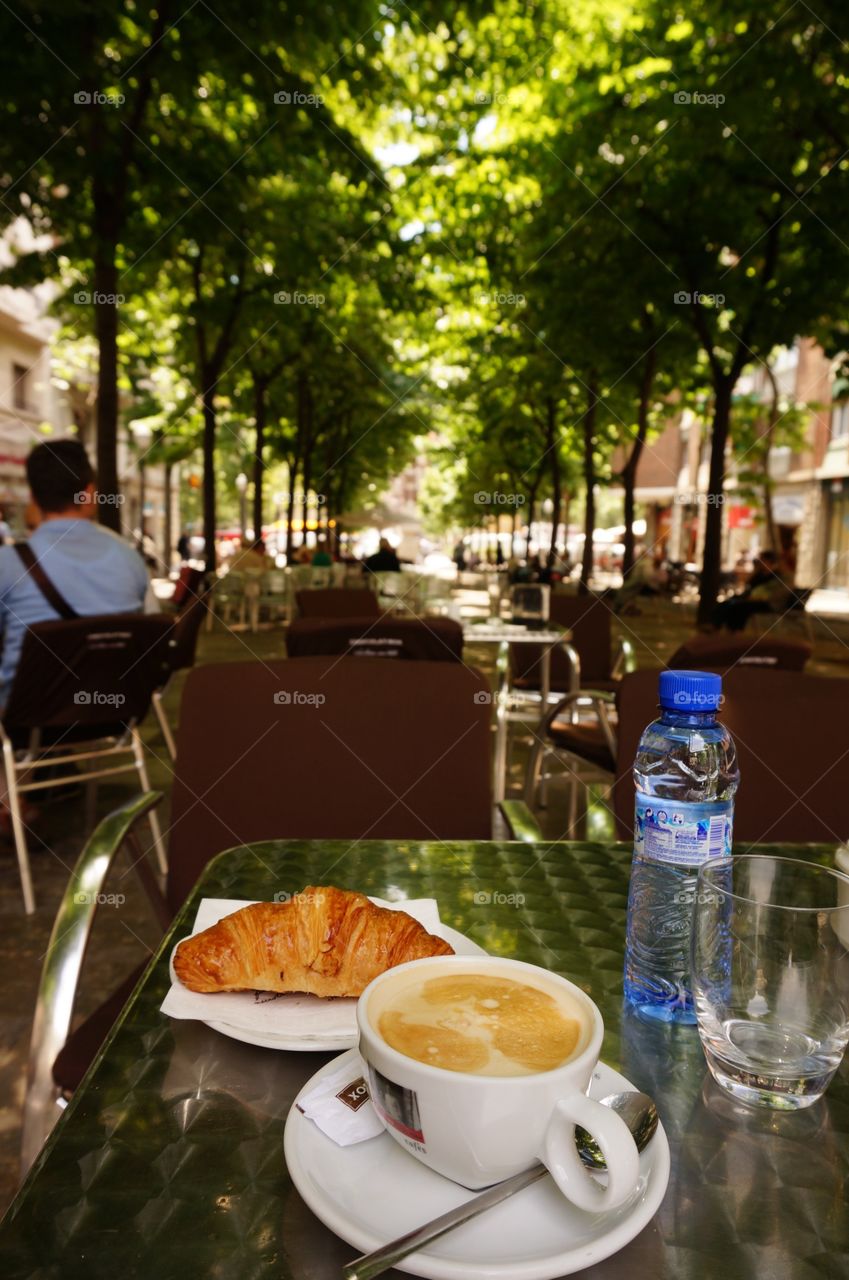 A break in Barcelona . After working or walking in this beautiful city you need to sit down, refresh with coffee, bear or water 