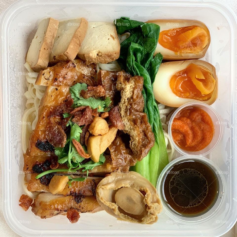 Chargrilled chicken and stewed pork al dente noodles with ramen egg and baby abalone 