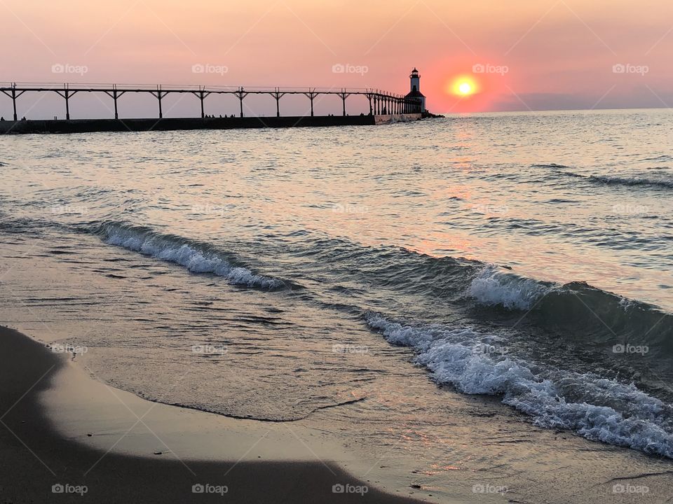 Lighthouse At Sunset
