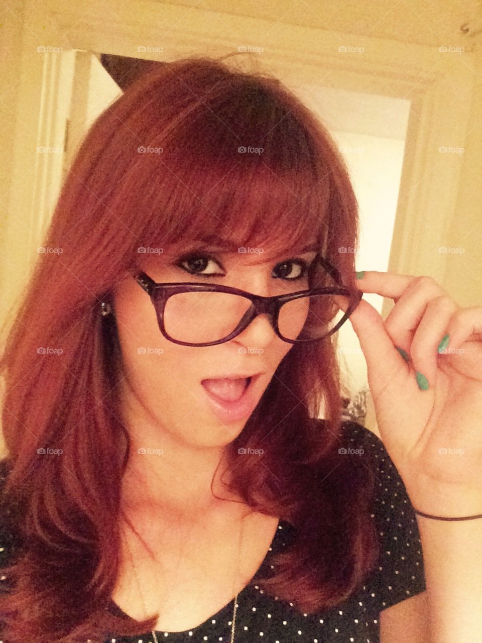 Redhead with her glasses