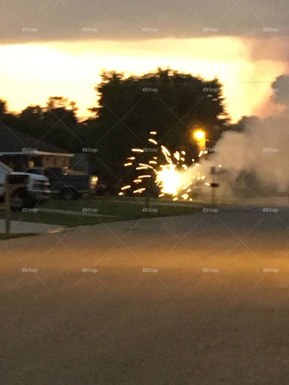 The sun is still up but the fireworks are beginning. Celebrating Independence Day!