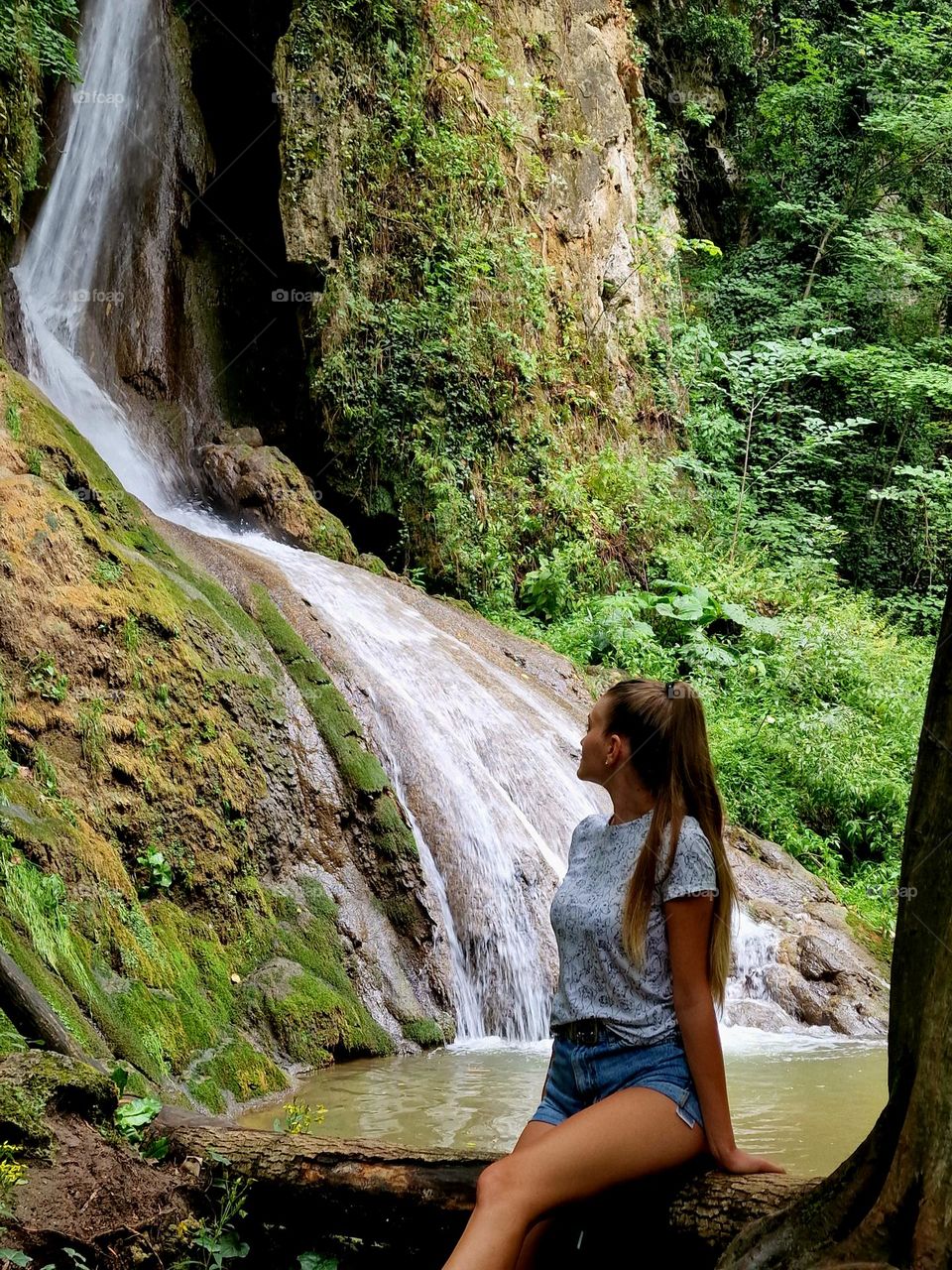 natural blonde girl and the waterfall