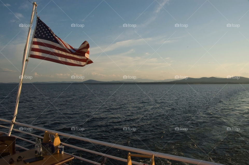 Flag blowing in the wind on Lake Champagne