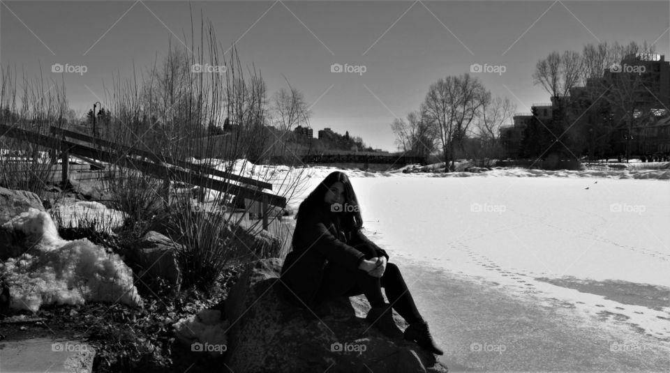 Girl posing black and white frozen river