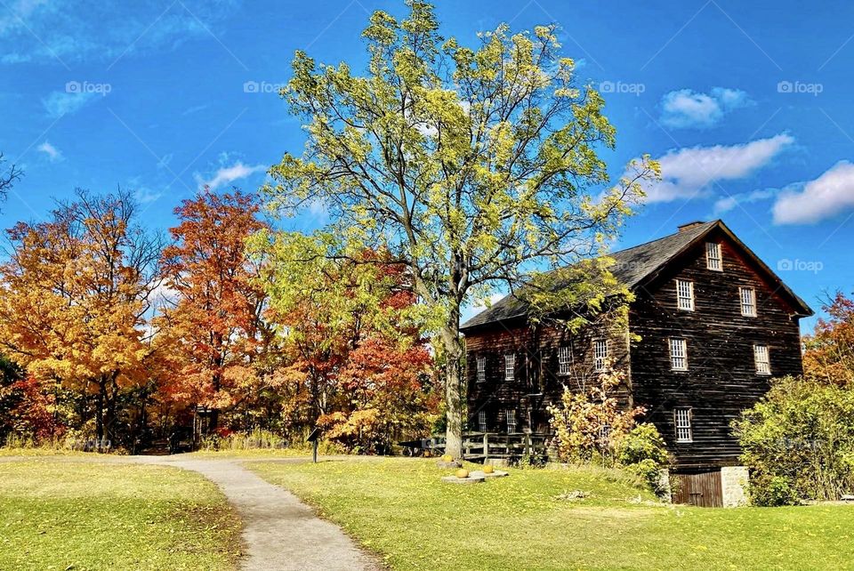 Rural fall scene with an old mill.