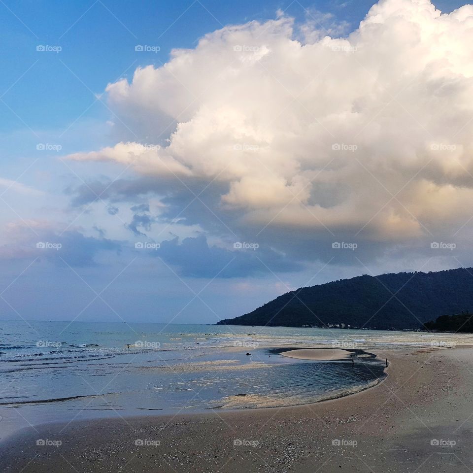 Scenic view of coastline against sky