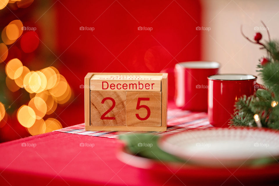 Christmas background with wooden block calendar with the date of December 25