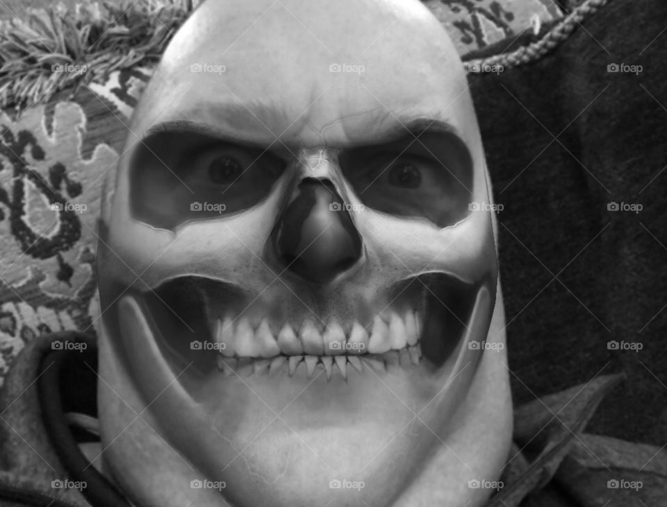 Close-up of a man wearing skeleton mask