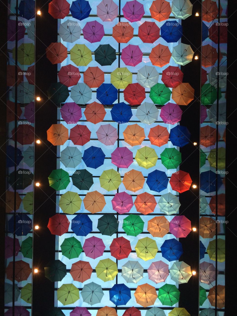 Colourful, pretty, and symmetrical arrangements of umbrellas. 