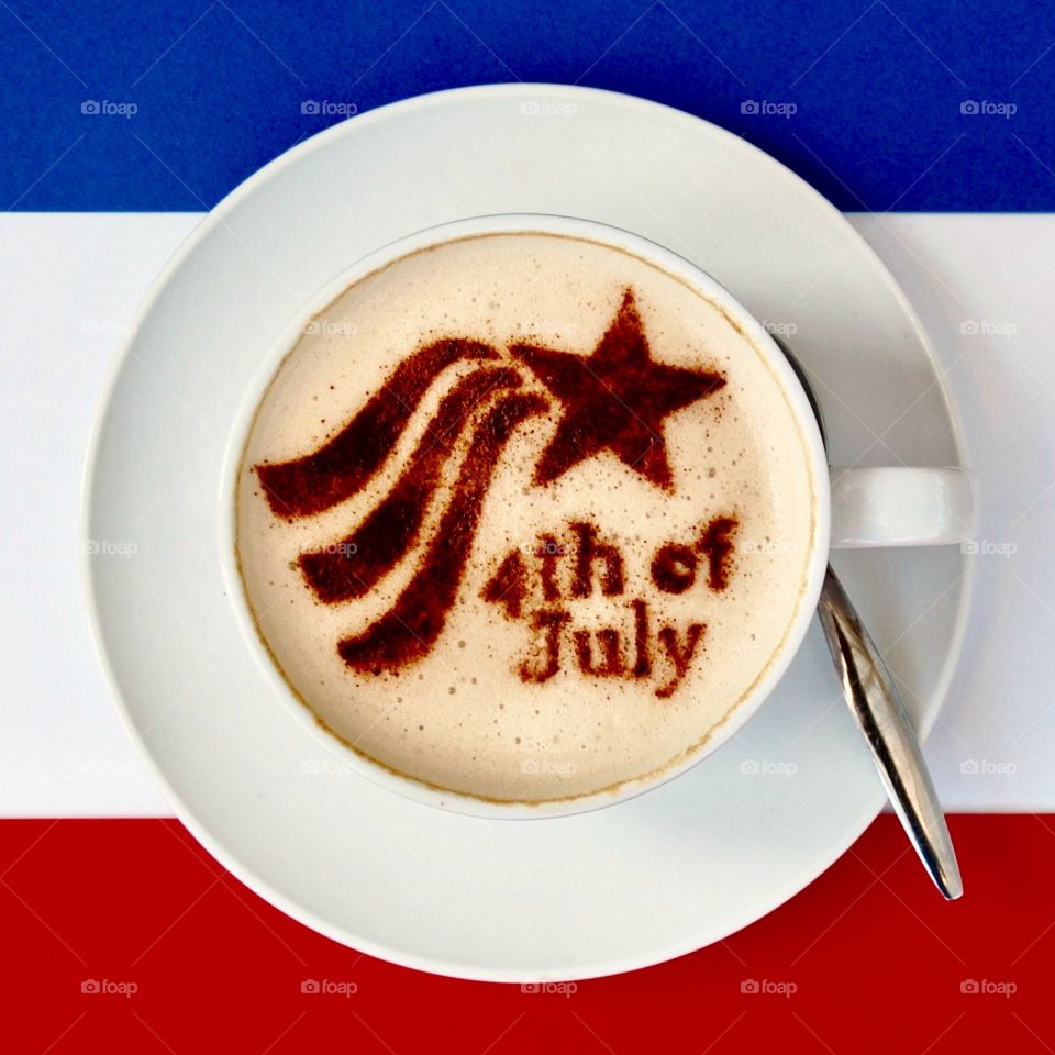 Coffee art celebrating American Independence Day, July 4th, with red white and blue background. 