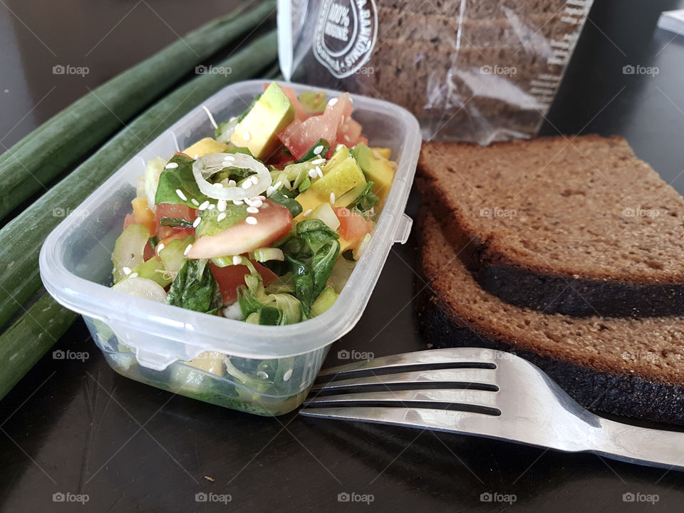 Lunchbox with homemade vegetable salad at work or school