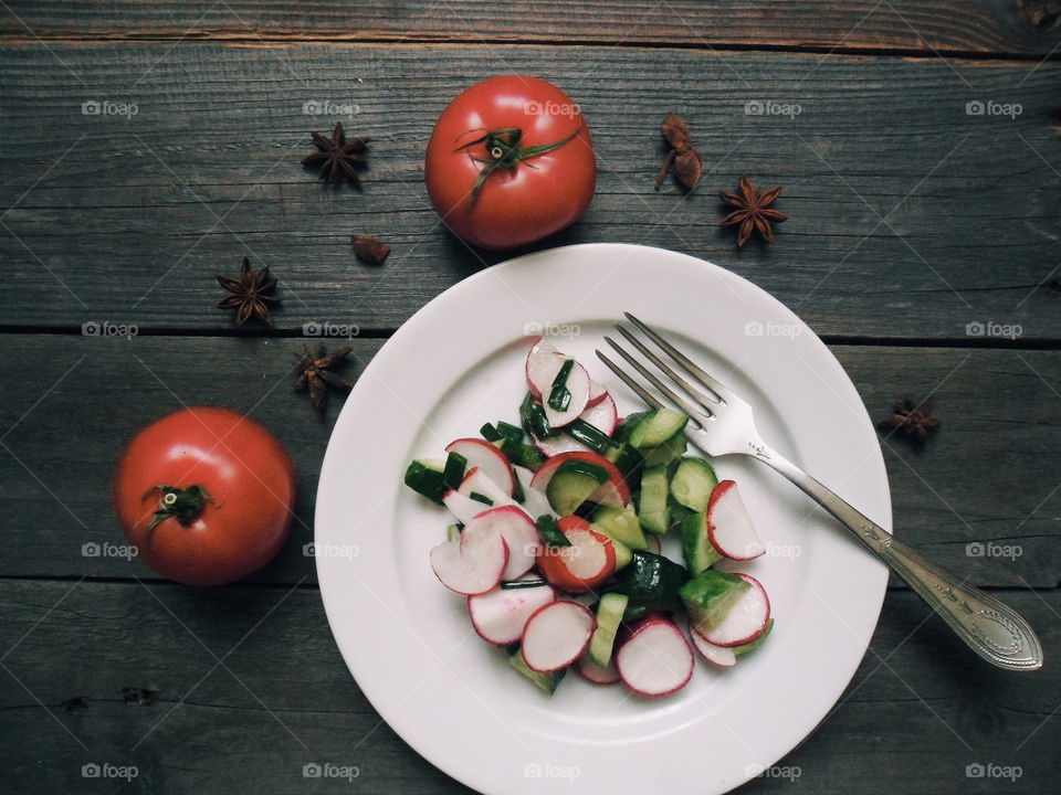 lettuce and tomatoes on a plat