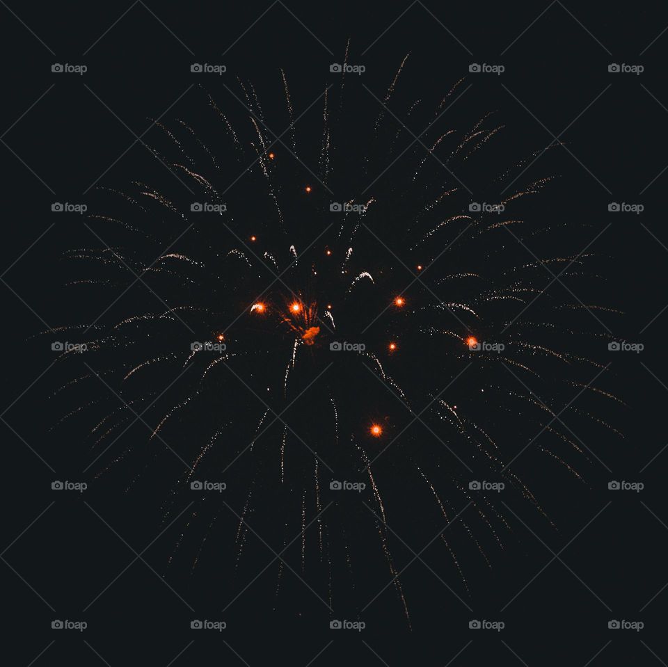 Firework caught in action just before it fades.