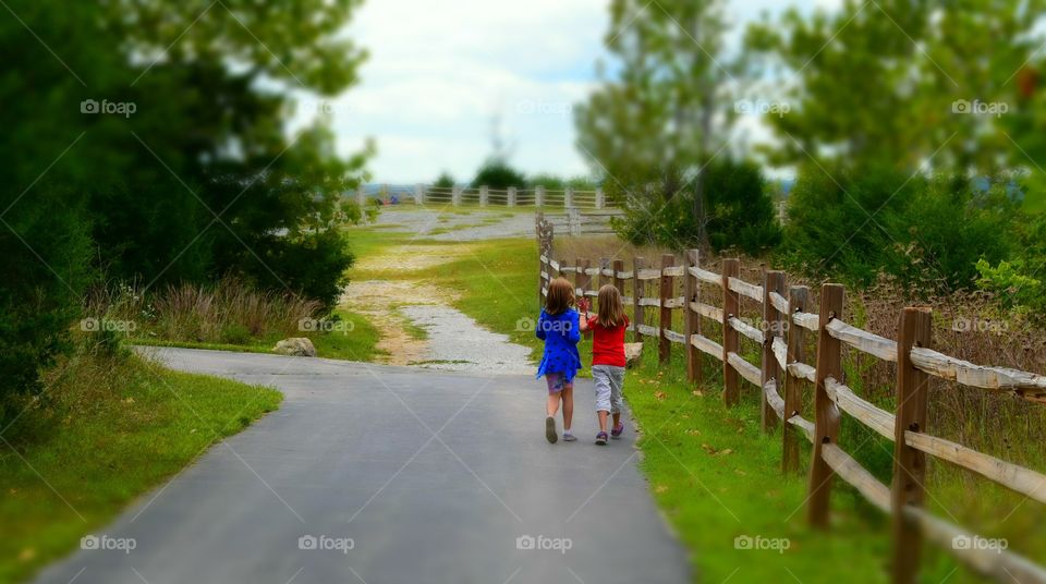 BFF's. My daughter and her friend walking along a path