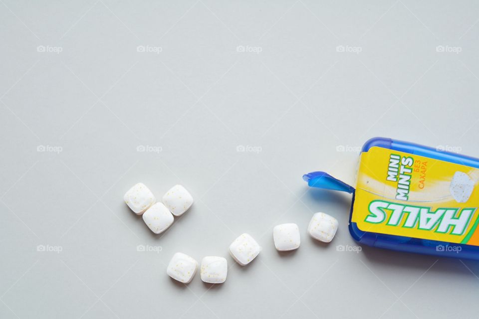 mint candy and box on a white top view background