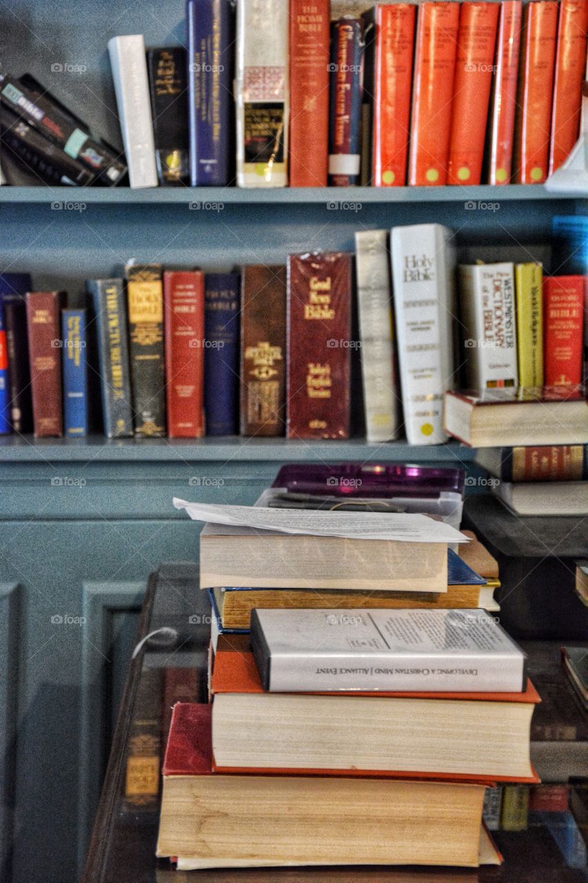 A shelf full and a pile of used books