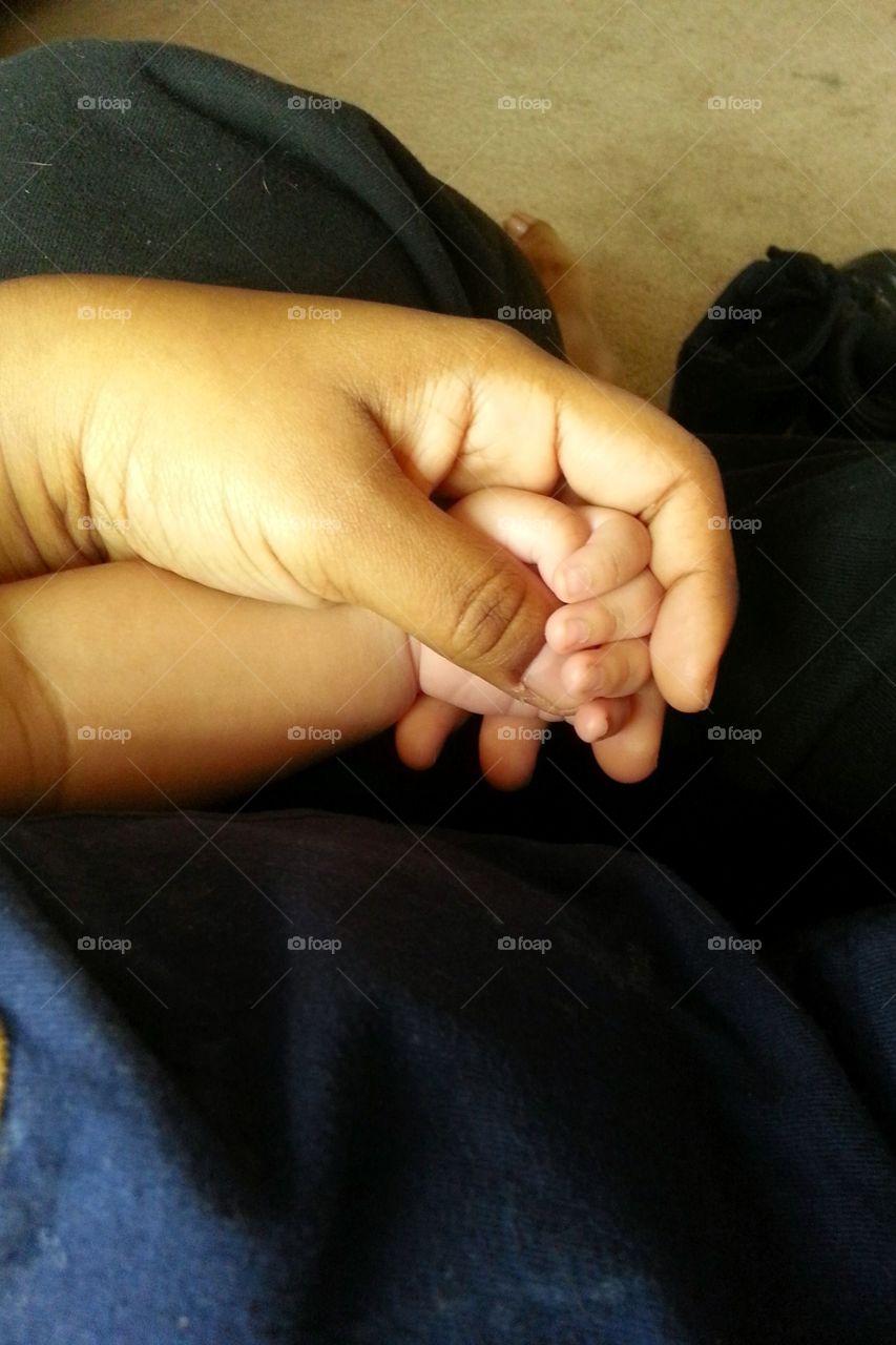 Tiny Hands. A picture of me holding my newborns hands while he sleeps.
