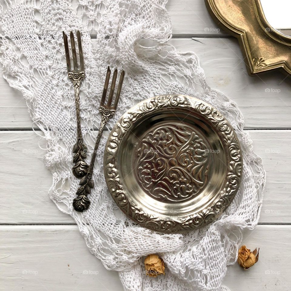 Vintage metal set of two silver forks and silver plate for olives