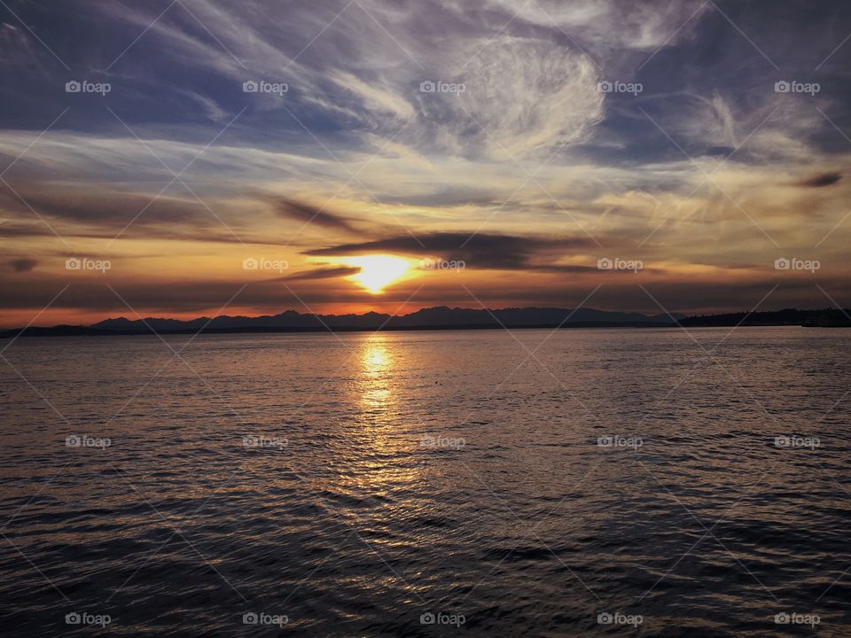 Sun Setting over Puget Sound with Olympic Mountains in background