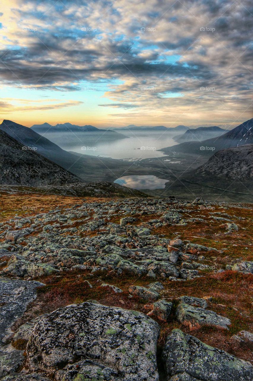 Light fog down under. Photo shot from "Brosmetinden" on the Island "Kvaløya" in the northern part of Norway. The village below is "Tromvik".