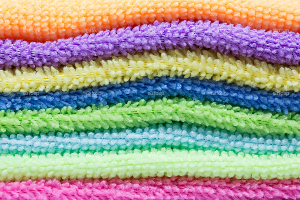 Colorful folded towels in many different colors 