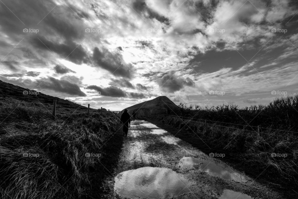 Person walking on dirt road