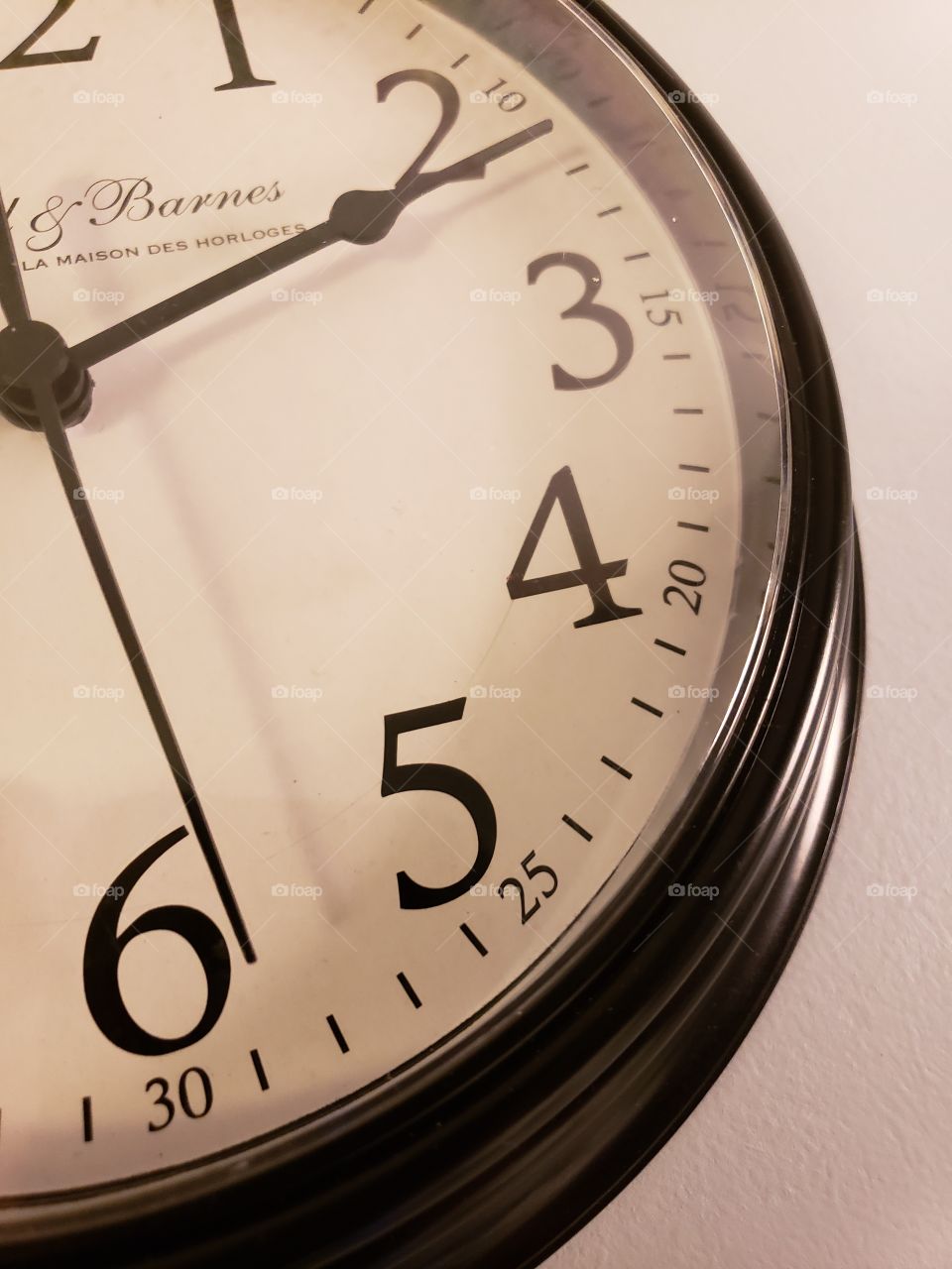 close up of clock with second hand at the 6
