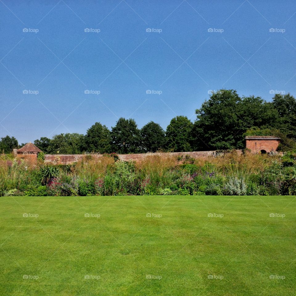 	Formal gardens of Packwood House stately home - Warwickshire, England UK.