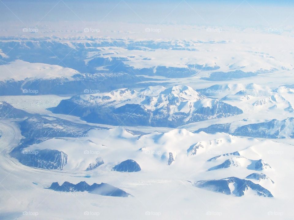 Flying over the snowy mountains