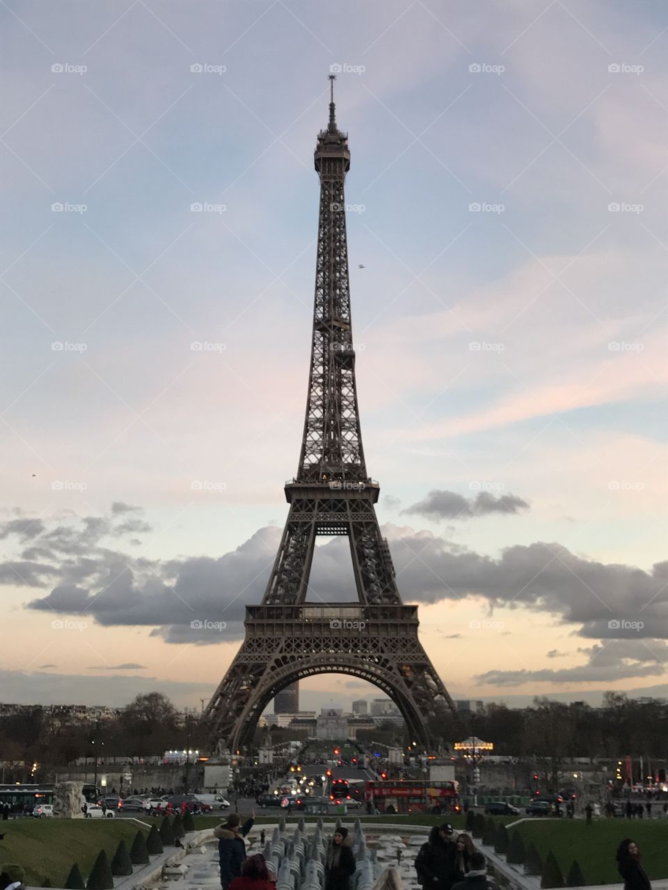 The Eiffel Tower featuring the natural beauty of the sky before sunset. 