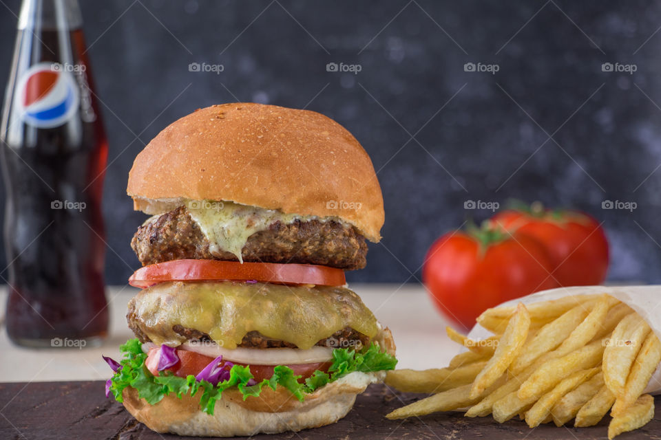 Double cheese burger and Pepsi