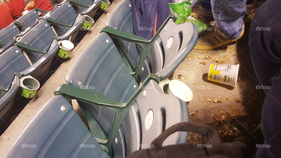 messy stadium seats after a baseball game