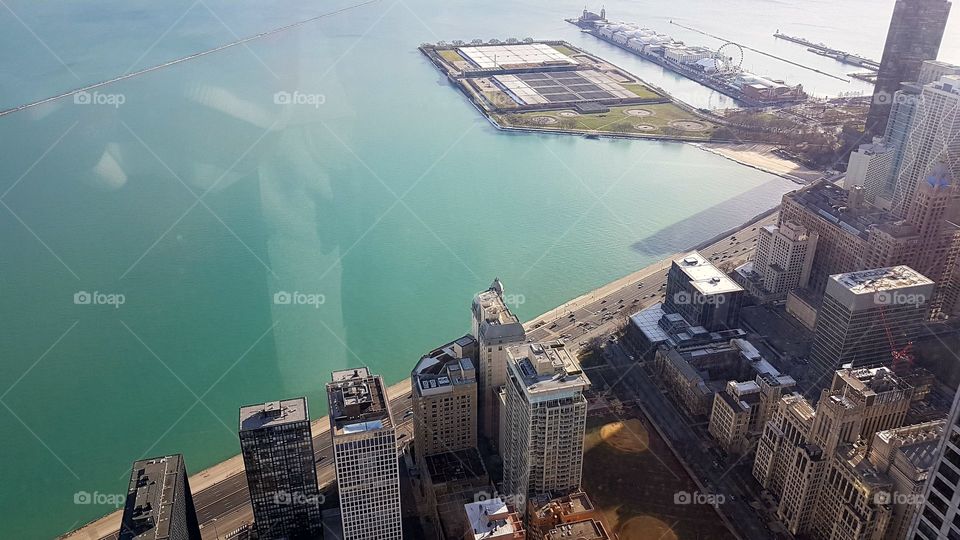 Chicago skyline panoramic day view from Willis Tower. Chicago City skyscrapers view inside observation floor at Sears Tower.