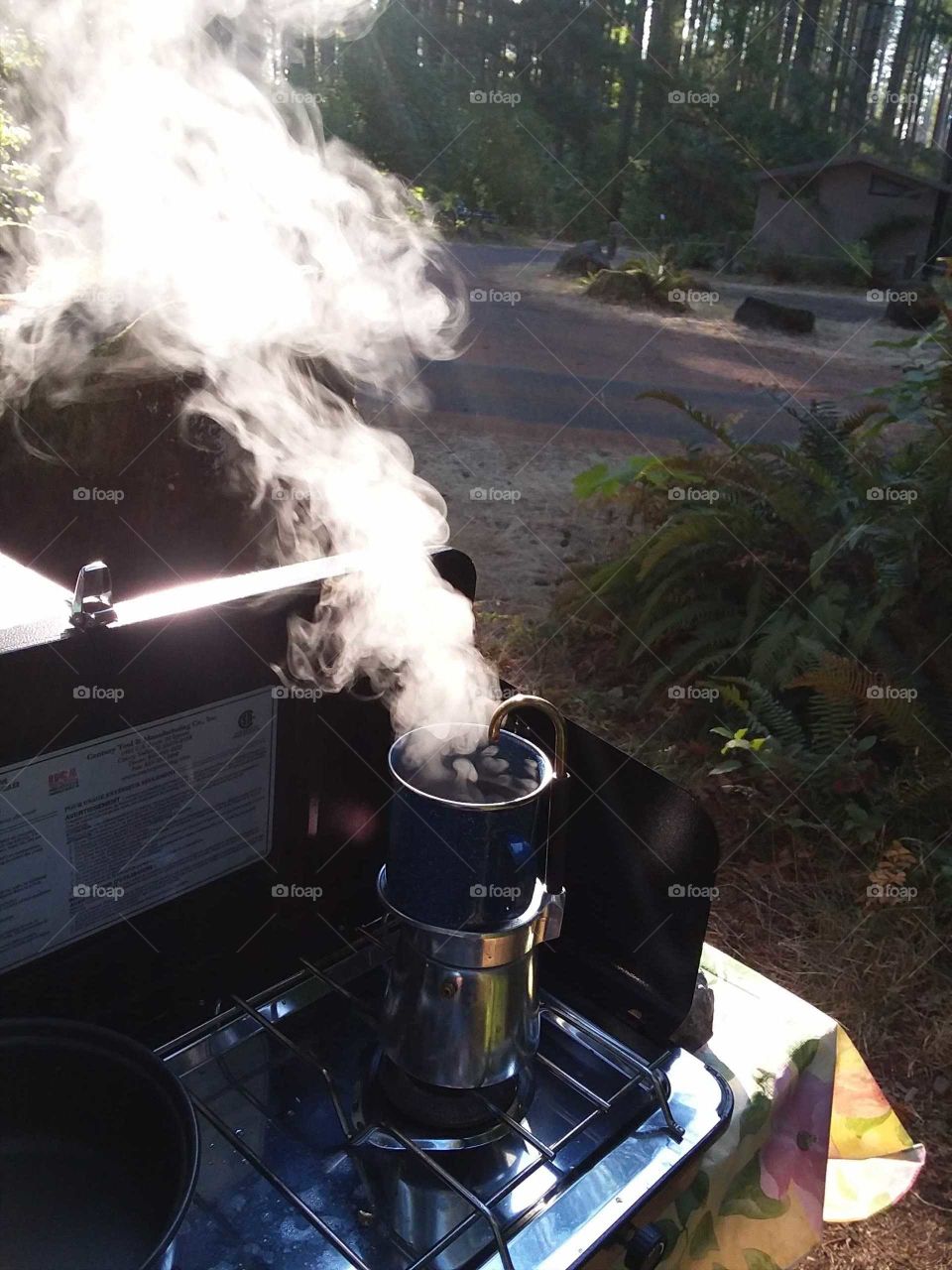 Brewing coffee outside camping with smoke