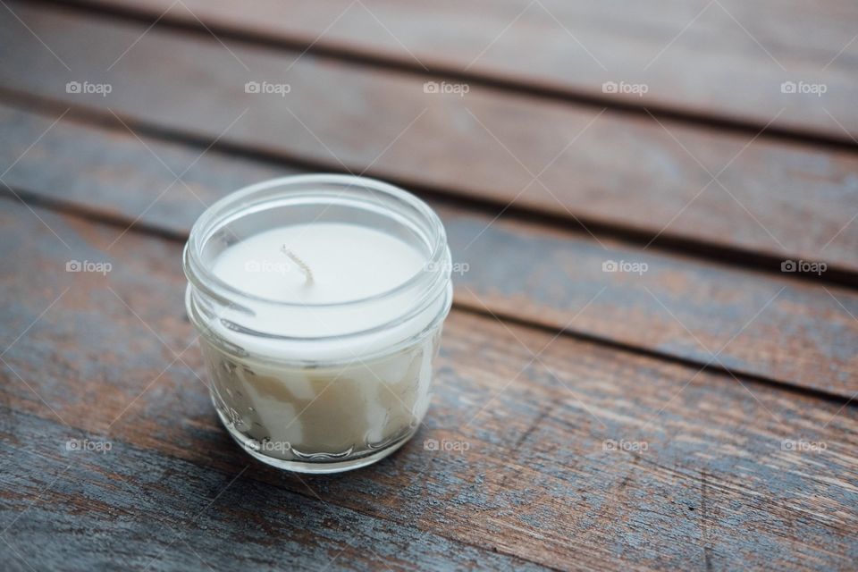 candle on a picnic table