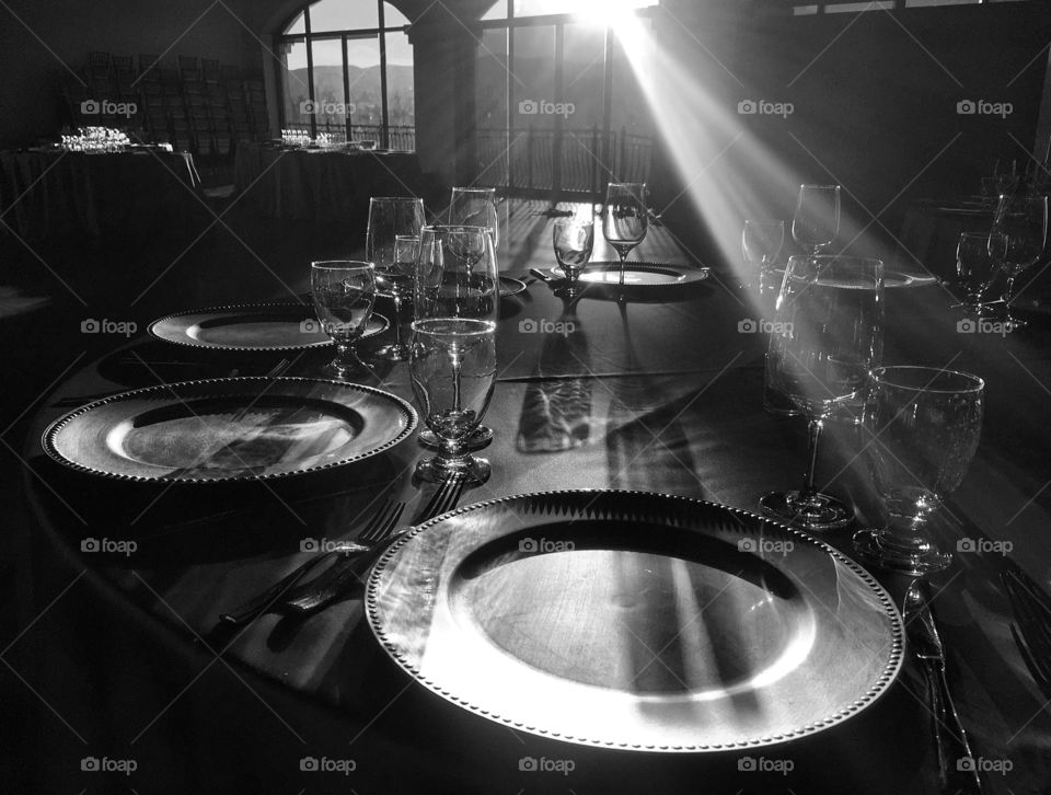 Light shining on a table setting black and white