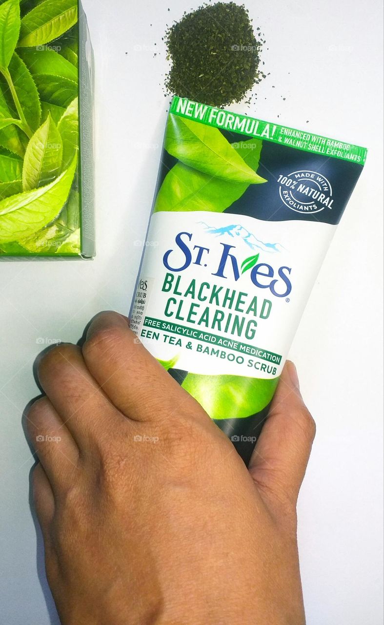 St. Ives - Blackhead clearing - green tea and bamboo scrub in a hand with green tea in the background- Beauty products I love