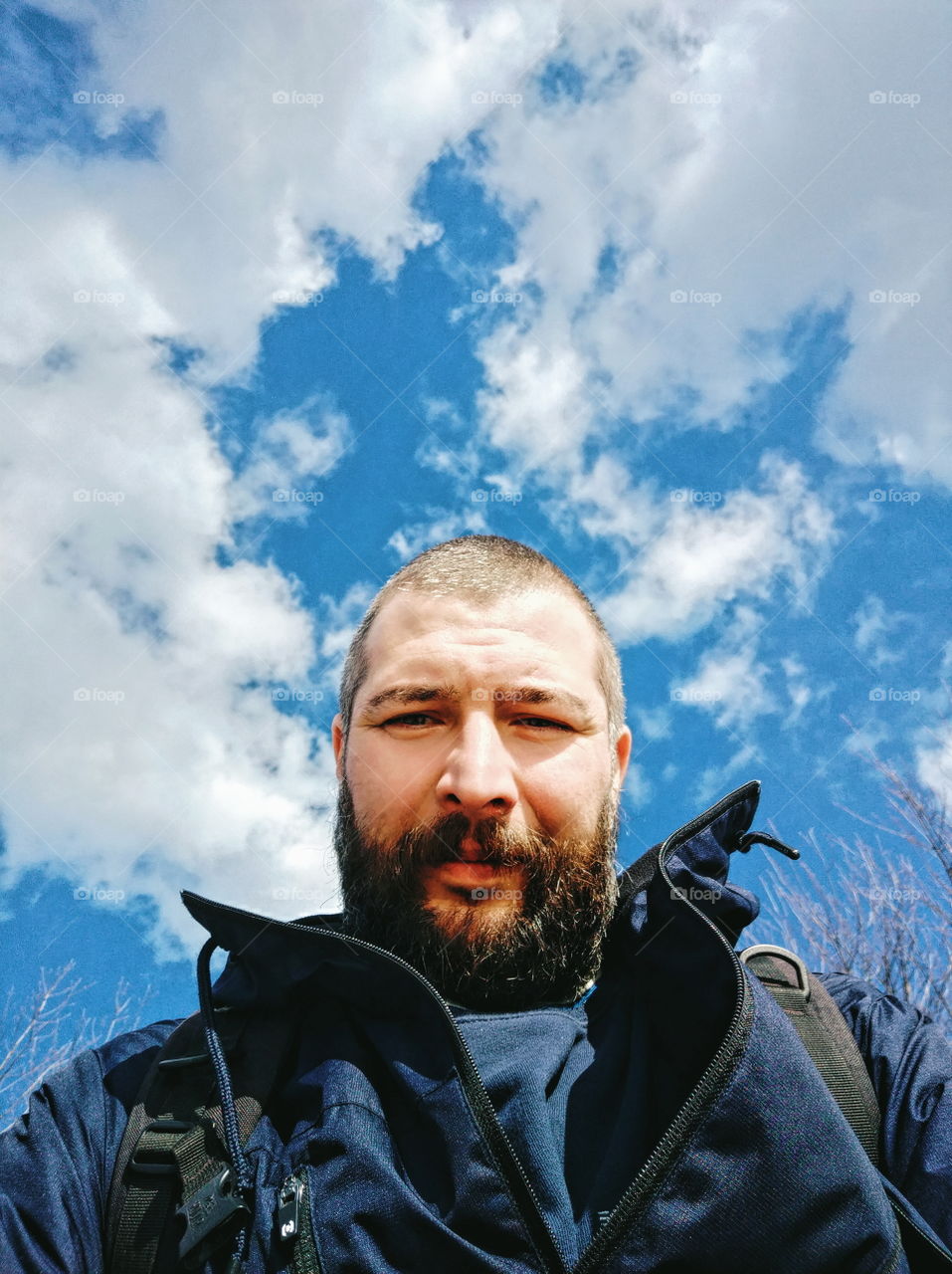 man with a beard against the sky