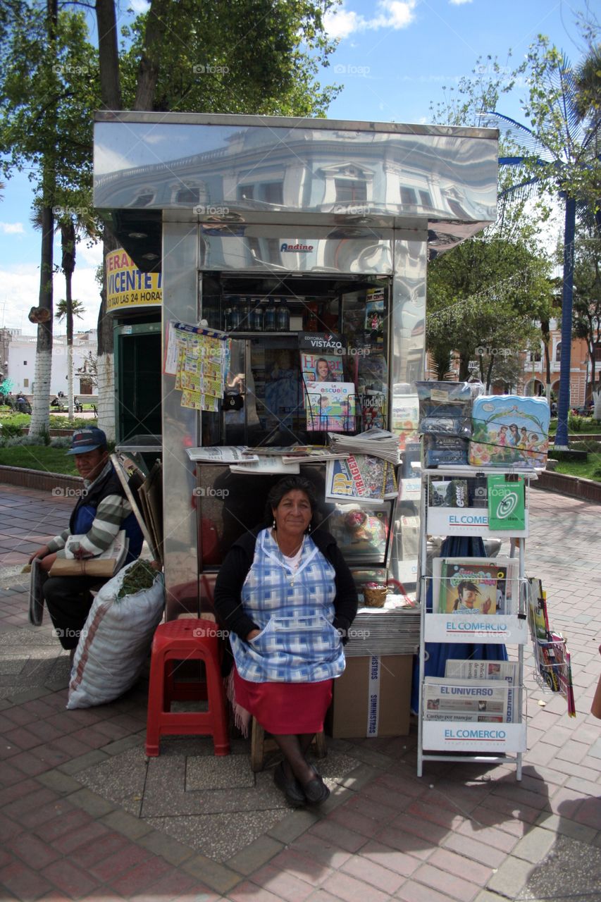 Vendor selling newspapers and magazines in Riobamba Ecuador.