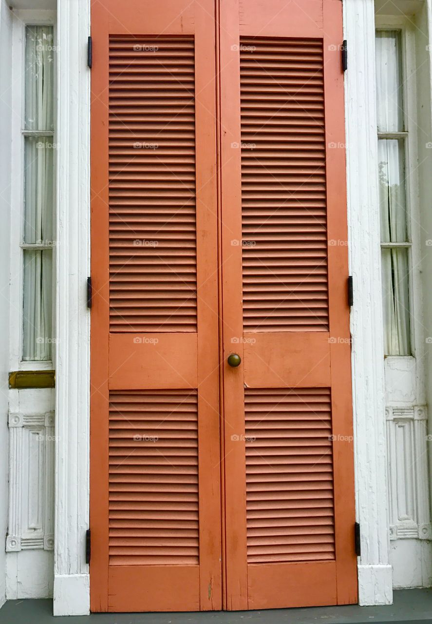 Orange shutters of house