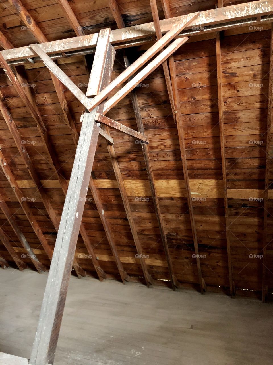 Wood paneling in an old rustic barn hayloft.