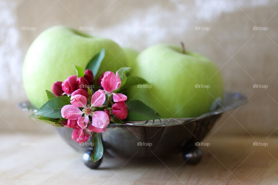 Green apple and flowers