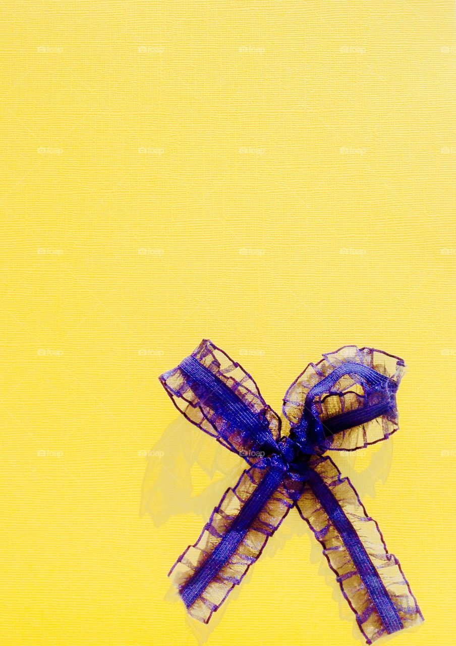Blue ribbon yellow background 