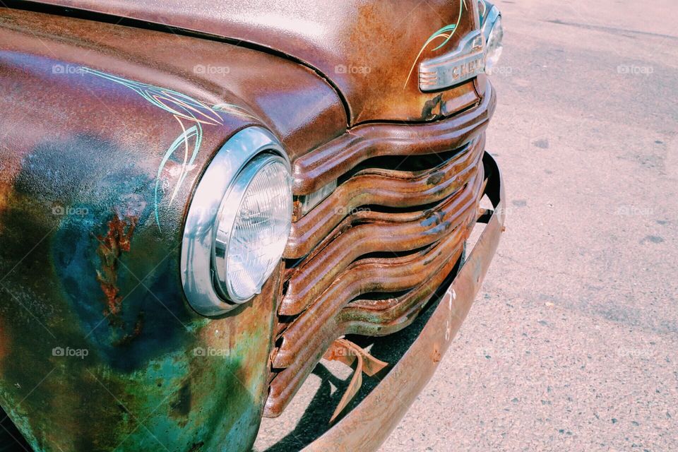 Front of a vintage rusty car