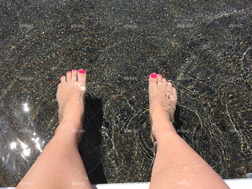Feet in water