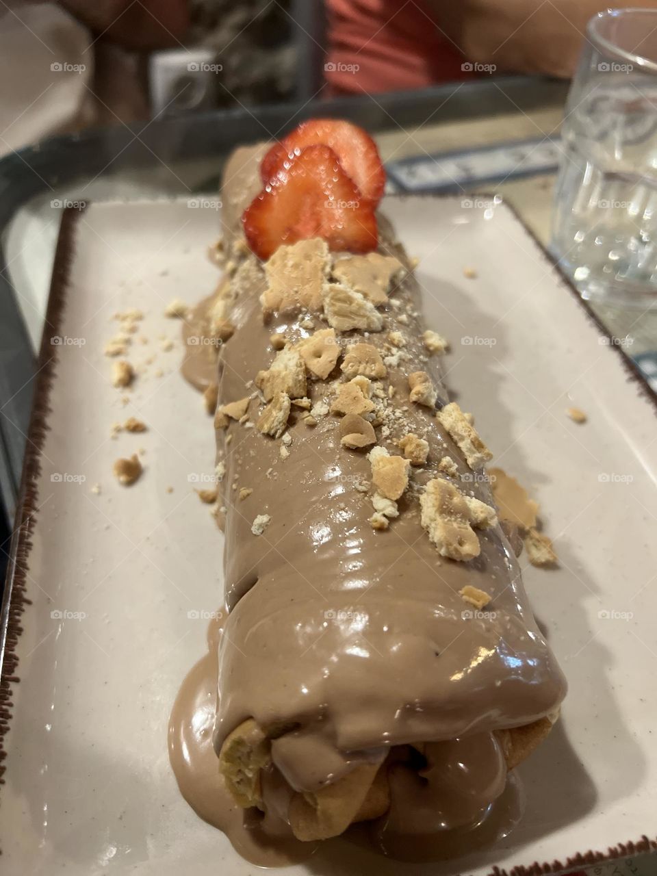 Crepe roll on with bueno chocolate nuts and strawberries 